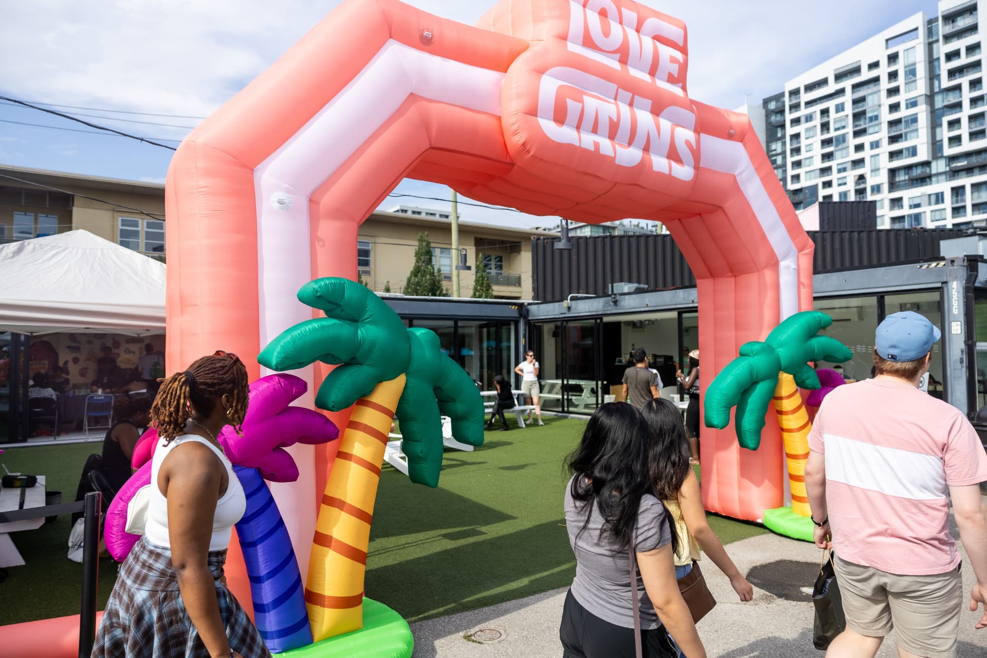 Guests entering the colourful Love Gains event
